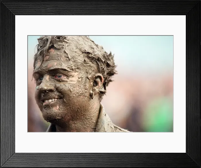 Framed Print : Fans covered in mud, at Margam Park to watch Catatonia performing, South Wales