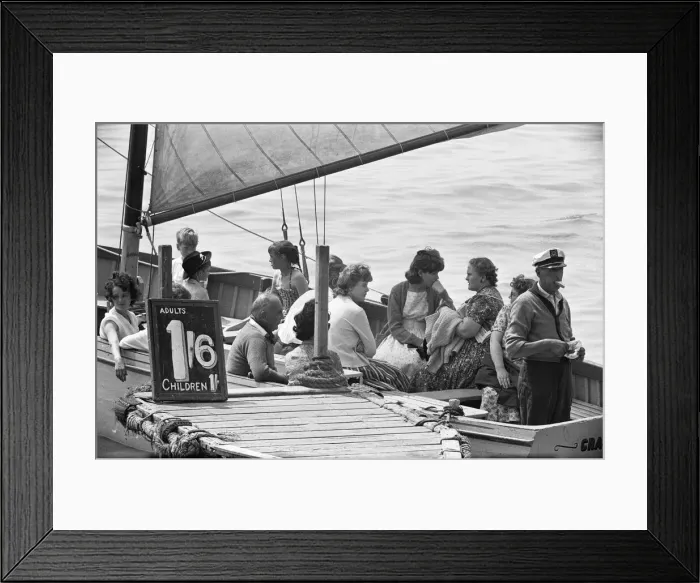 Framed Print : The captain of the Grace Darling has a sandwich whilst waiting to fill his boat with