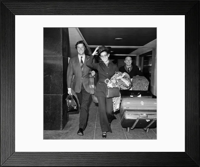 Framed Print : Roger Moore and his wife Luisa heading off on their honeymoon. 13th April 1969 Framed Print : Roger Moore and his wife Luisa heading off on their honeymoon. 13th April 1969
