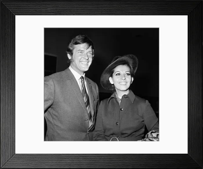 Framed Print : Roger Moore and his wife Luisa heading off on their honeymoon. 13th April 1969 Framed Print : Roger Moore and his wife Luisa heading off on their honeymoon. 13th April 1969