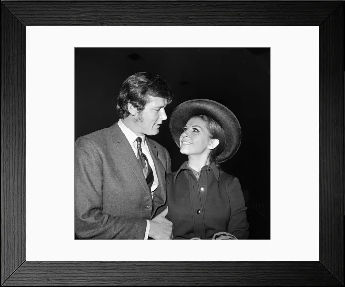 Framed Print : Roger Moore and his wife Luisa heading off on their honeymoon. 13th April 1969 Framed Print : Roger Moore and his wife Luisa heading off on their honeymoon. 13th April 1969