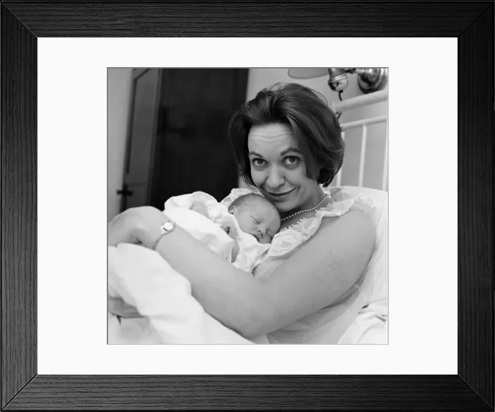 Framed Print : Holding her 12-hour old baby is stage and TV actress Lillias Walker Framed Print : Holding her 12-hour old baby is stage and TV actress Lillias Walker