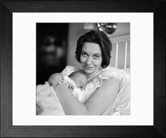 Framed Print : Holding her 12-hour old baby is stage and TV actress Lillias Walker