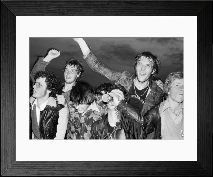 Framed Print : Music fans watching bands performing on Saturday night at the Reading Festival