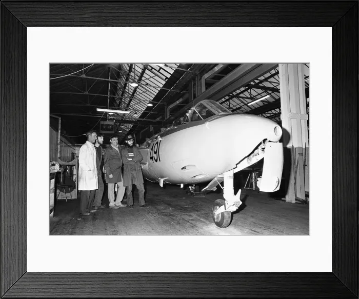 Framed Print : A lovingly restored Seahawk Hawker jet fighter is checked over by workers at the city