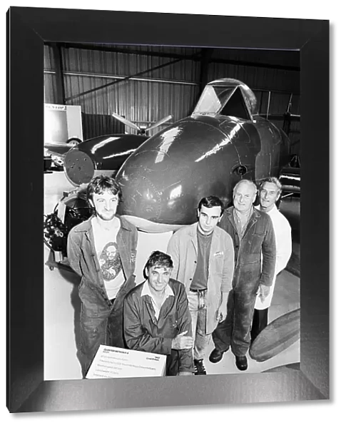 Workers posing with their lovingly restored Gloster Meteor as the 45 year old plane goes