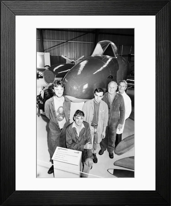 Framed Print : Workers posing with their lovingly restored Gloster Meteor as the 45 year old plane goes Framed Print : Workers posing with their lovingly restored Gloster Meteor as the 45 year old plane goes