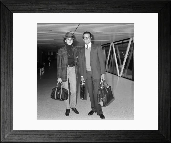 Framed Print : James Bond star Roger Moore turned up in another role today - as a devoted father Framed Print : James Bond star Roger Moore turned up in another role today - as a devoted father