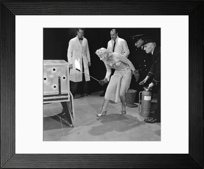 Framed Print : 4 of 9 - June McComb lights the aluminium coffin, to supposedly roast Framed Print : 4 of 9 - June McComb lights the aluminium coffin, to supposedly roast