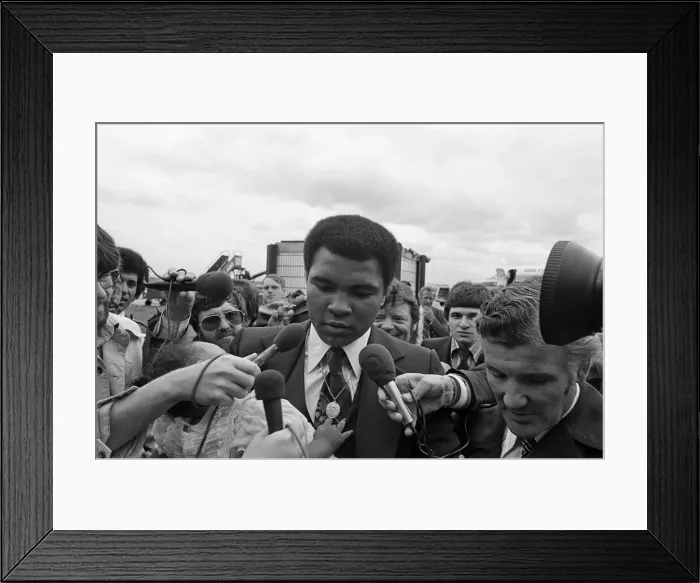 Framed Print : Muhammad Ali arrives at Teesside Airport with his family. July 1977 Framed Print : Muhammad Ali arrives at Teesside Airport with his family. July 1977
