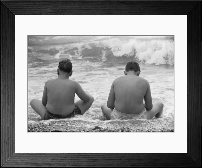 Framed Print : Holiday scenes at Brighton To young boys sitting in the sea to cool off during Framed Print : Holiday scenes at Brighton To young boys sitting in the sea to cool off during