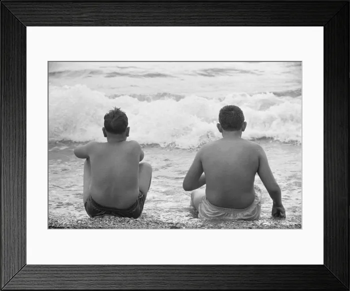Framed Print : Holiday scenes at Brighton To young boys sitting in the sea to cool off during Framed Print : Holiday scenes at Brighton To young boys sitting in the sea to cool off during