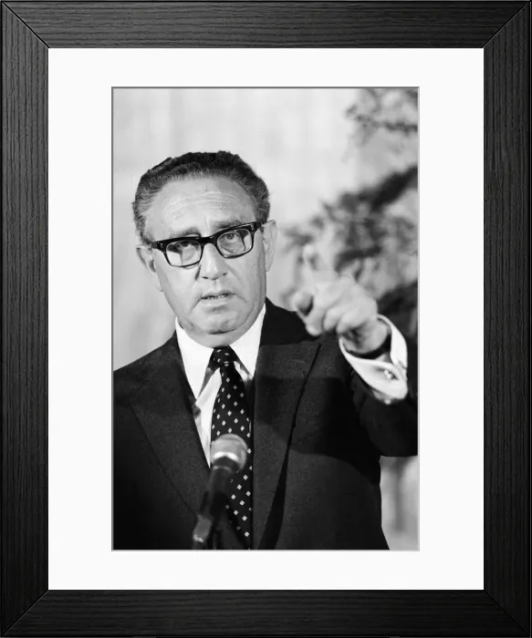 Framed Print : Henry Kissinger speaking at a press conference, answering questions about his latest book