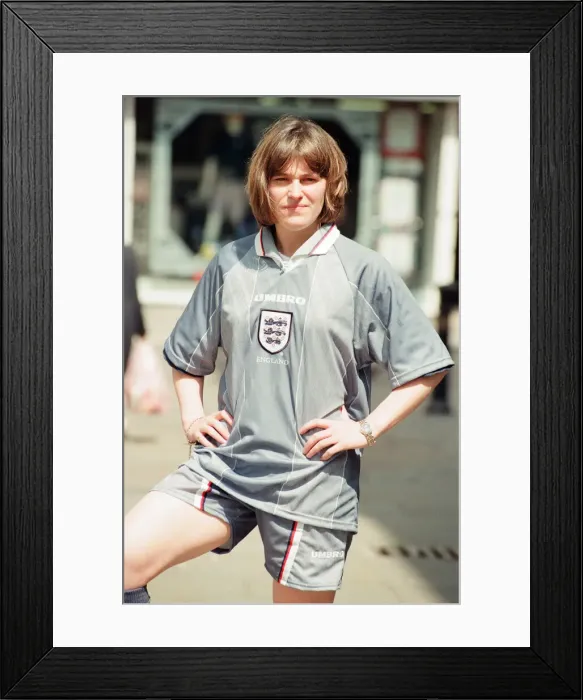 Framed Print : Shop asistant Karen Burke from Soccer City, models Englands Grey Strip, Liverpool Framed Print : Shop asistant Karen Burke from Soccer City, models Englands Grey Strip, Liverpool