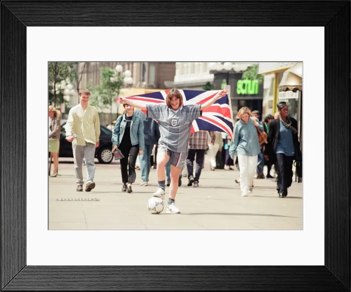 Framed Print : Shop asistant Karen Burke from Soccer City, models Englands Grey Strip, Liverpool Framed Print : Shop asistant Karen Burke from Soccer City, models Englands Grey Strip, Liverpool