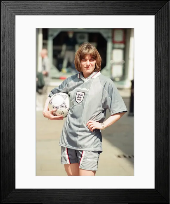 Framed Print : Shop asistant Karen Burke from Soccer City, models Englands Grey Strip, Liverpool Framed Print : Shop asistant Karen Burke from Soccer City, models Englands Grey Strip, Liverpool