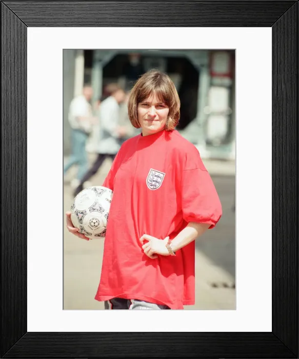 Framed Print : Shop asistant Karen Burke from Soccer City, models Englands old Red Strip, Liverpool Framed Print : Shop asistant Karen Burke from Soccer City, models Englands old Red Strip, Liverpool