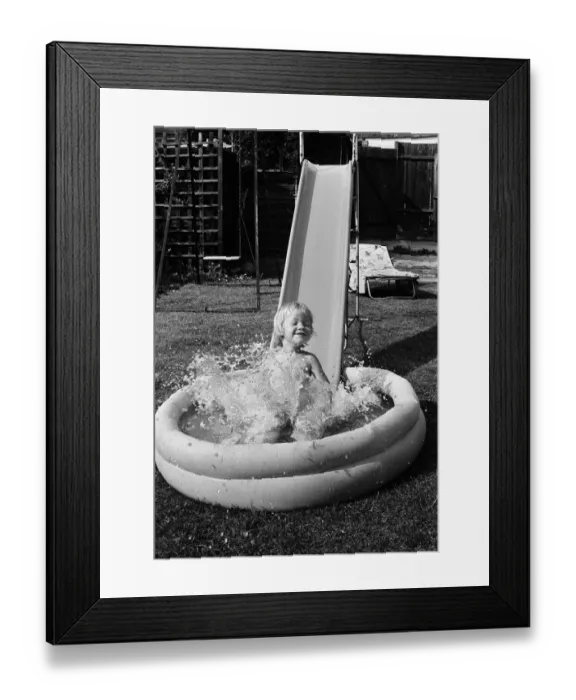 Framed Print : Mark Gordon cools off from the summer sun in his paddling pool. 28th June 1976 Framed Print : Mark Gordon cools off from the summer sun in his paddling pool. 28th June 1976