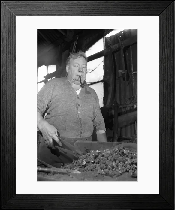 Framed Print : Blacksmith Horace Tubby Lovegrove seen here at work at his forge Framed Print : Blacksmith Horace Tubby Lovegrove seen here at work at his forge