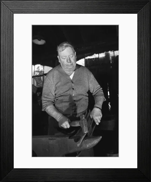 Framed Print : Blacksmith Horace Tubby Lovegrove seen here at work at his forge Framed Print : Blacksmith Horace Tubby Lovegrove seen here at work at his forge