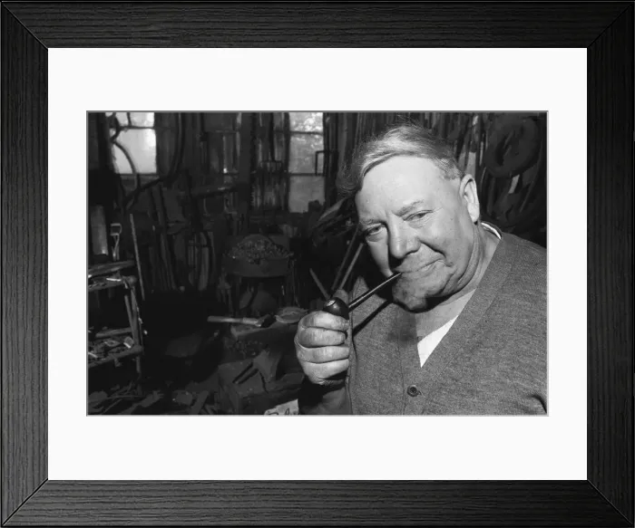 Framed Print : Blacksmith Horace Tubby Lovegrove seen here at work at his forge Framed Print : Blacksmith Horace Tubby Lovegrove seen here at work at his forge