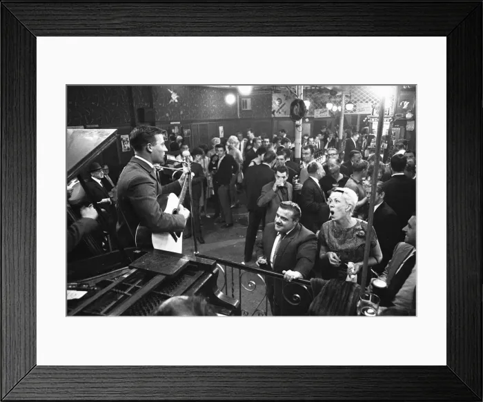 Framed Print : Cabaret singer performing in a East End of London pub on a Saturday night. 6th July 1963