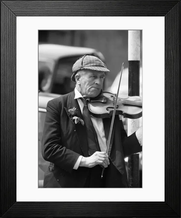 Framed Print : Elderly street musician performing on the streets of central London Framed Print : Elderly street musician performing on the streets of central London