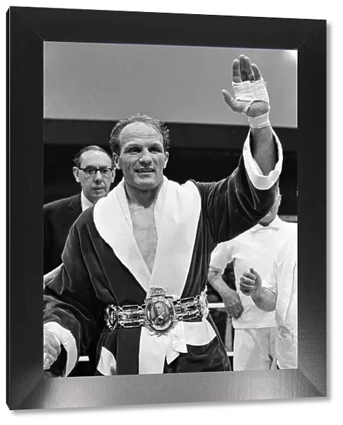 Henry Cooper receiving the Lonsdale belt after his win in the fight against Jack Bodell