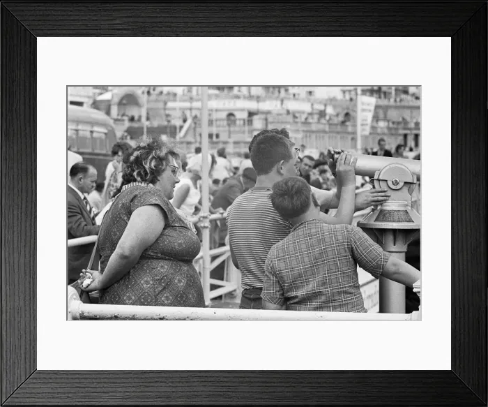 Framed Print : Holiday scenes at Brighton. Holidaymakers on Brighton Framed Print : Holiday scenes at Brighton. Holidaymakers on Brighton