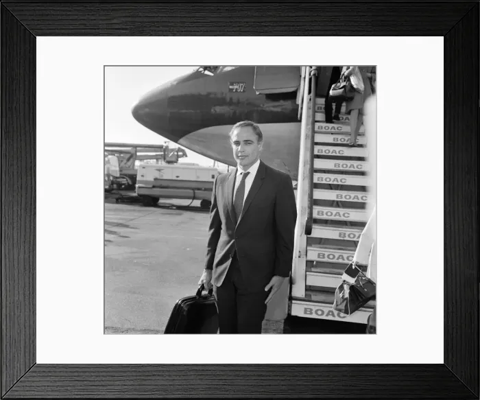 Framed Print : Marlon Brando arrives at Heathrow Airport in London, to take part in a television Framed Print : Marlon Brando arrives at Heathrow Airport in London, to take part in a television