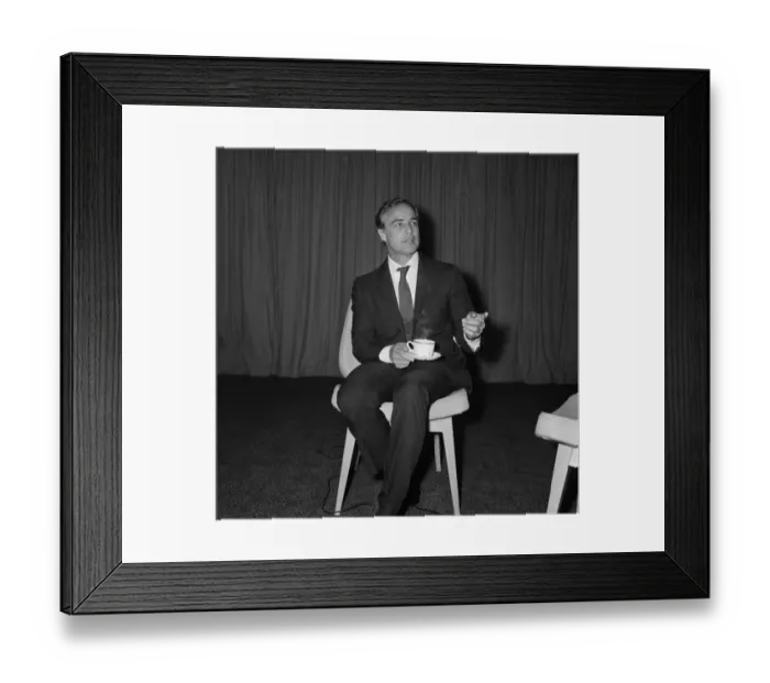 Framed Print : Marlon Brando arrives at Heathrow Airport in London, to take part in a television