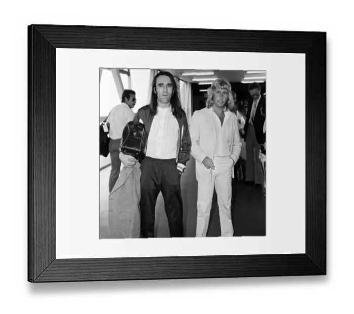 Framed Print : Rick Parfitt (right) and Francis Rossi (left) of the Status Quo pop group arriving