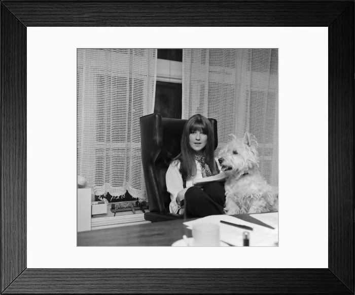 Framed Print : Cathy McGowan, English Television Personality, pictured in her office with her dog
