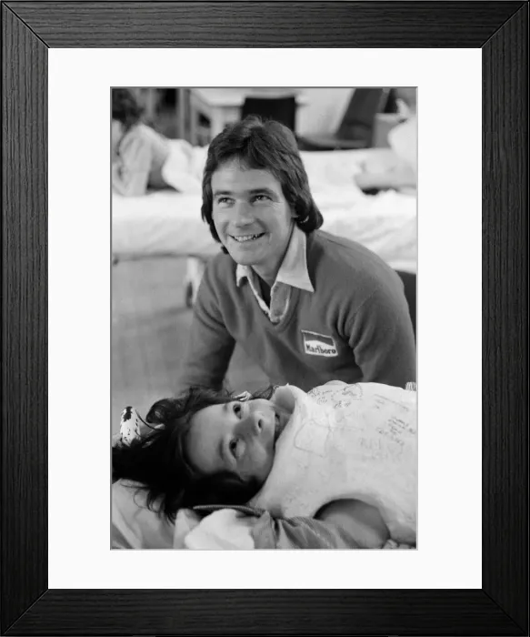 Framed Print : British Motorcycle road racer Barry Sheene with young fan Tony Vickers who is undergoing Framed Print : British Motorcycle road racer Barry Sheene with young fan Tony Vickers who is undergoing