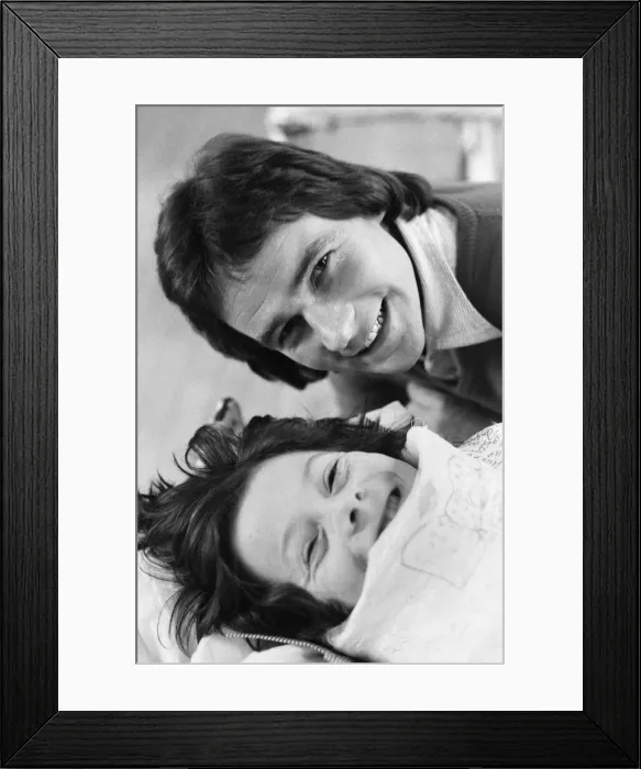 Framed Print : British Motorcycle road racer Barry Sheene with young fan Tony Vickers who is undergoing Framed Print : British Motorcycle road racer Barry Sheene with young fan Tony Vickers who is undergoing