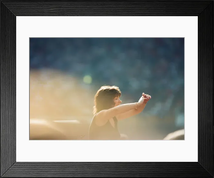 Framed Print : A lady aloft and enjoying the day, part of the huge audience watch American Rock Group Framed Print : A lady aloft and enjoying the day, part of the huge audience watch American Rock Group