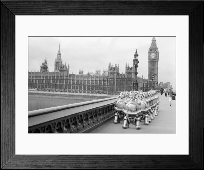Framed Print : Robots lined up over Westminster Bridge. The robots were supplied by EMI Records who used Framed Print : Robots lined up over Westminster Bridge. The robots were supplied by EMI Records who used