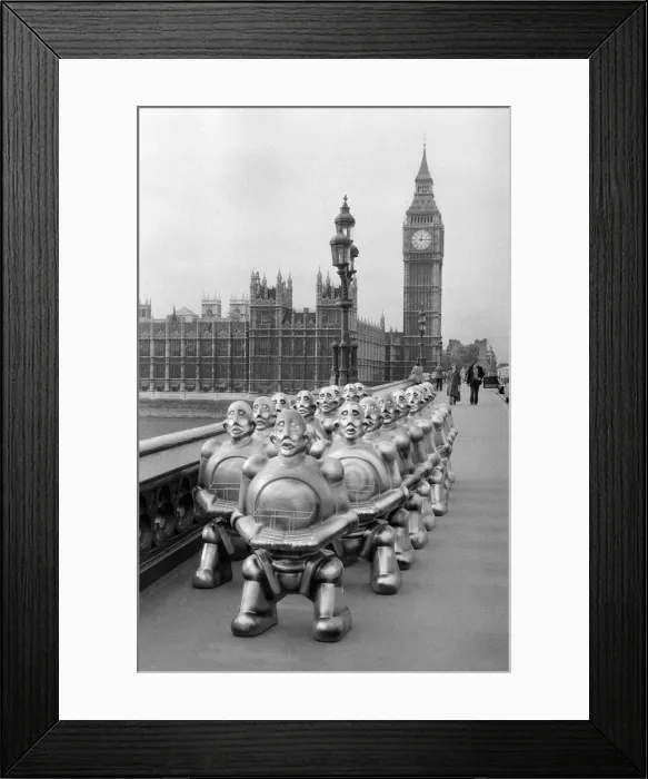 Framed Print : Robots lined up over Westminster Bridge. The robots were supplied by EMI Records who used Framed Print : Robots lined up over Westminster Bridge. The robots were supplied by EMI Records who used