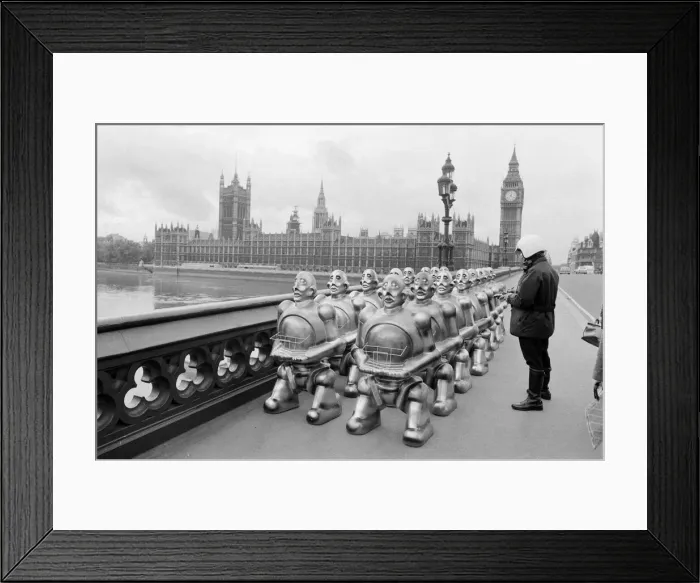 Framed Print : Robots lined up over Westminster Bridge. The robots were supplied by EMI Records who used Framed Print : Robots lined up over Westminster Bridge. The robots were supplied by EMI Records who used