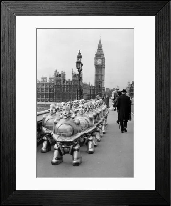 Framed Print : Robots lined up over Westminster Bridge. The robots were supplied by EMI Records who used Framed Print : Robots lined up over Westminster Bridge. The robots were supplied by EMI Records who used