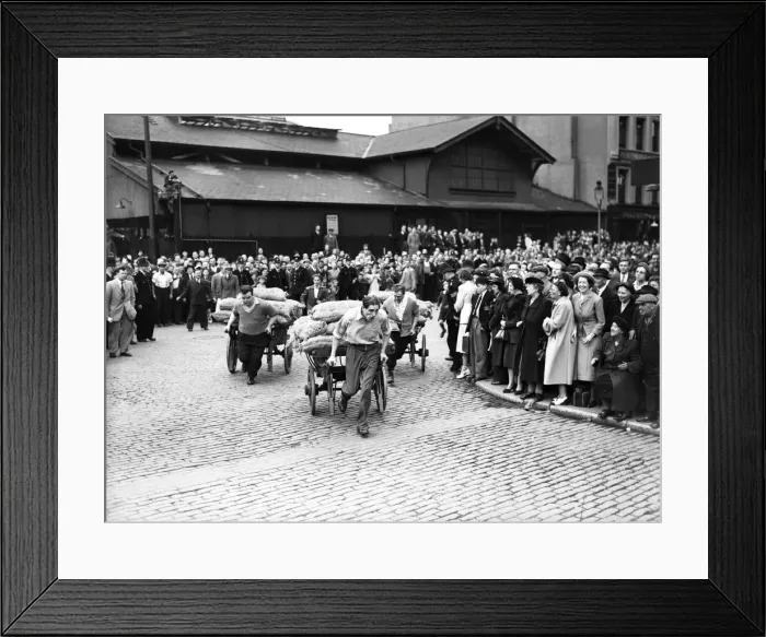 Framed Print : Porters from Covent Garden Flower and Vegetable market race their carts around Framed Print : Porters from Covent Garden Flower and Vegetable market race their carts around