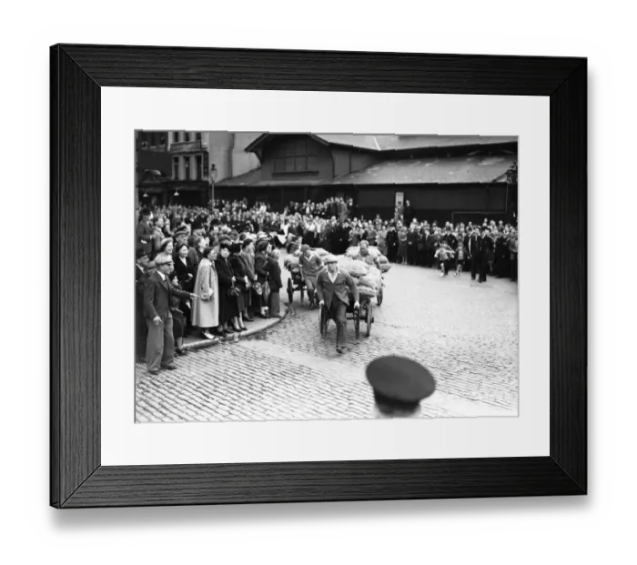 Framed Print : Porters from Covent Garden Flower and Vegetable market race their carts around Framed Print : Porters from Covent Garden Flower and Vegetable market race their carts around
