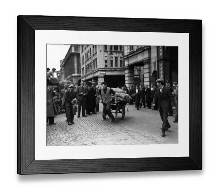 Framed Print : Porters from Covent Garden Flower and Vegetable market race their carts around Framed Print : Porters from Covent Garden Flower and Vegetable market race their carts around