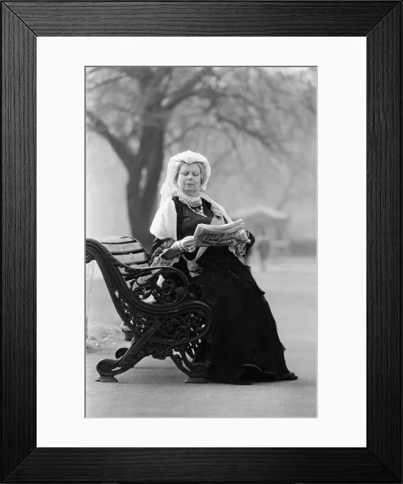 Framed Print : A Queen Victoria lookalike sitting on a park bench in Kensington Gardens close Royal