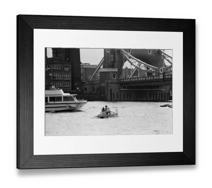 Framed Print : Television presenter Peter Duncan in a VW Beetle car in the River Thames