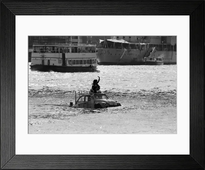 Framed Print : Television presenter Peter Duncan in a VW Beetle car in the River Thames Framed Print : Television presenter Peter Duncan in a VW Beetle car in the River Thames