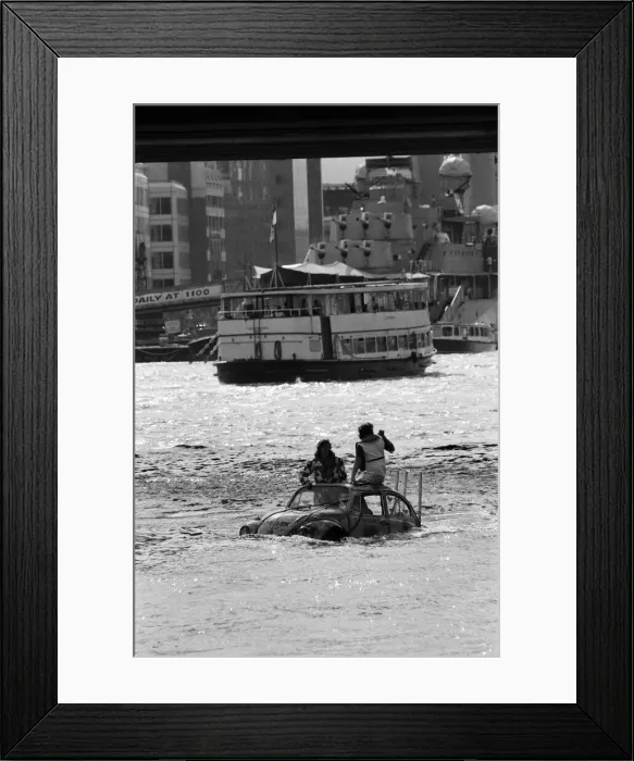 Framed Print : Television presenter Peter Duncan in a VW Beetle car in the River Thames Framed Print : Television presenter Peter Duncan in a VW Beetle car in the River Thames