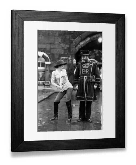 Framed Print : Beefeater Rory Crozier looks on with disbelief as disco dancer Lucia Catti (18 Framed Print : Beefeater Rory Crozier looks on with disbelief as disco dancer Lucia Catti (18