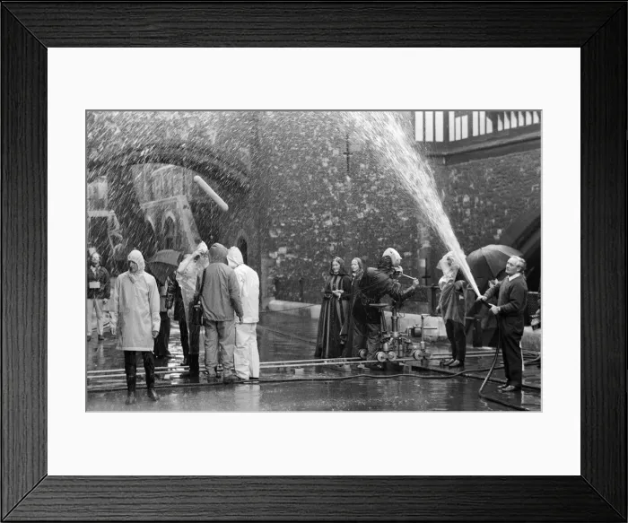 Framed Print : On a beautiful summers morning at the Tower of London, BBC film unit produced rain
