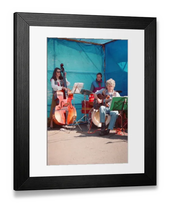 Framed Print : The Brecon Jazz Festival. Brecon, South Wales, A small musical group perform Framed Print : The Brecon Jazz Festival. Brecon, South Wales, A small musical group perform